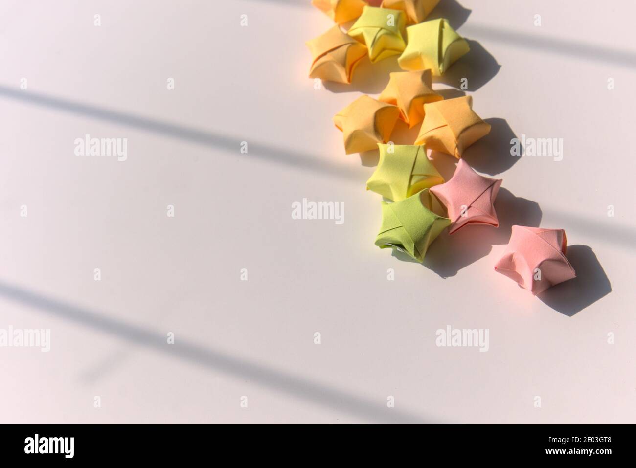 Colorful folded paper star or origami lucky stars, copy space ...