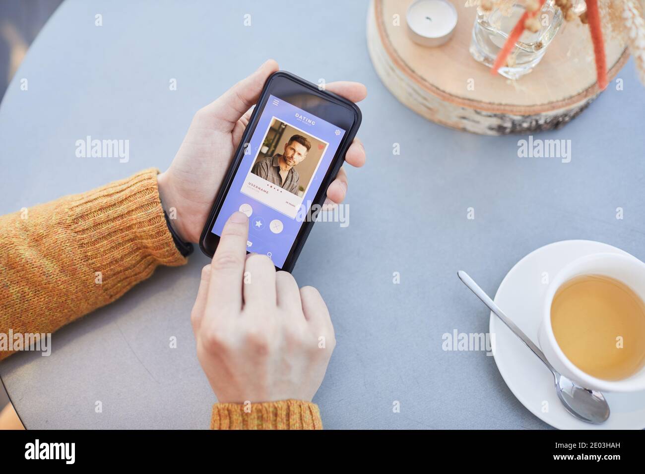 Close-up of man choosing a companion for online conversation using app ...