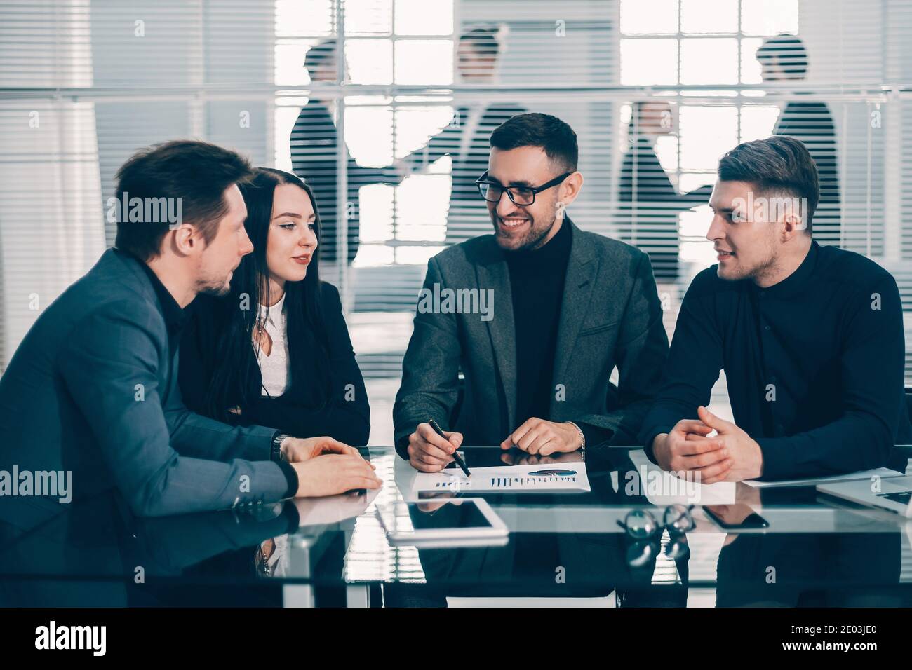 boss and business team analyzing financial data Stock Photo