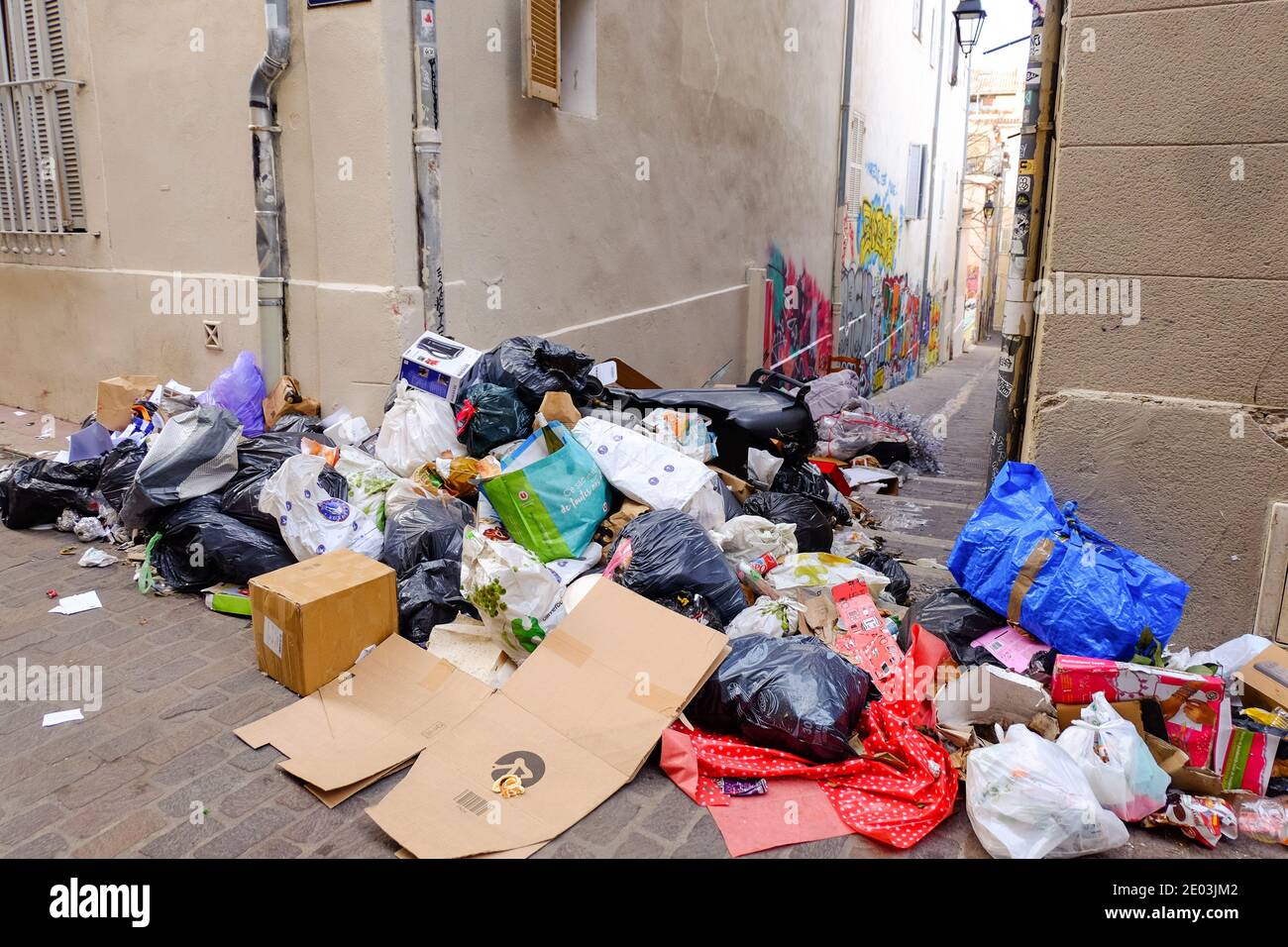 Piles of trash in black rubbish bags piled up on the pavement awaiting  collection in a street in New York Stock Photo - Alamy