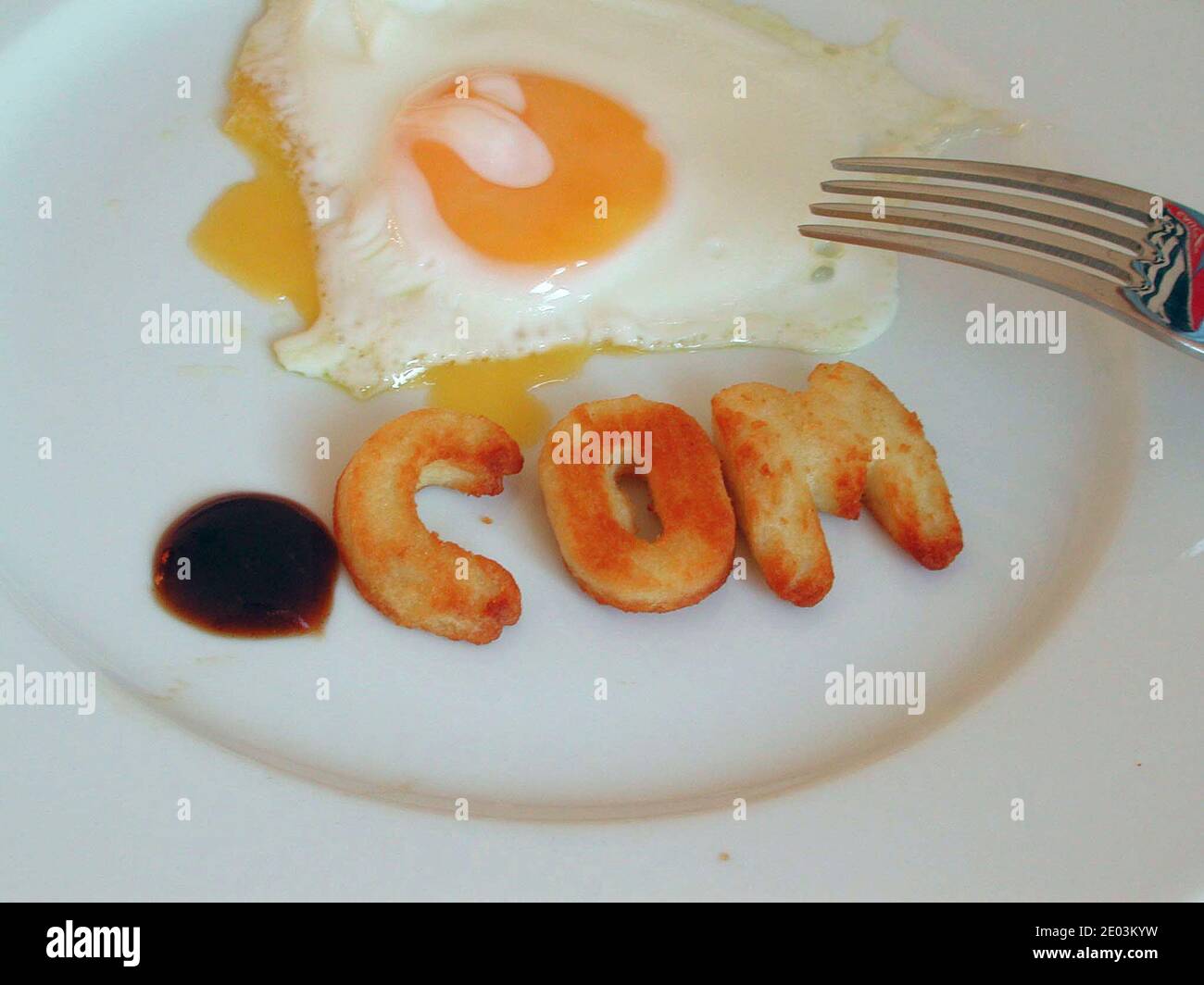 .com internet company suffix formed from alphabite chips on plate of ...