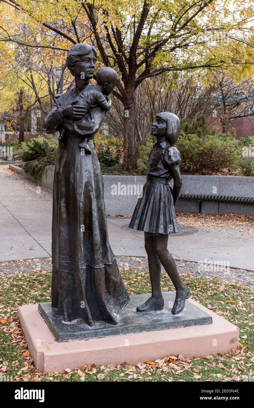 Bronze sculpture of a mother with her children located in Temple Square, downtown Salt Lake city, Utah. Stock Photo