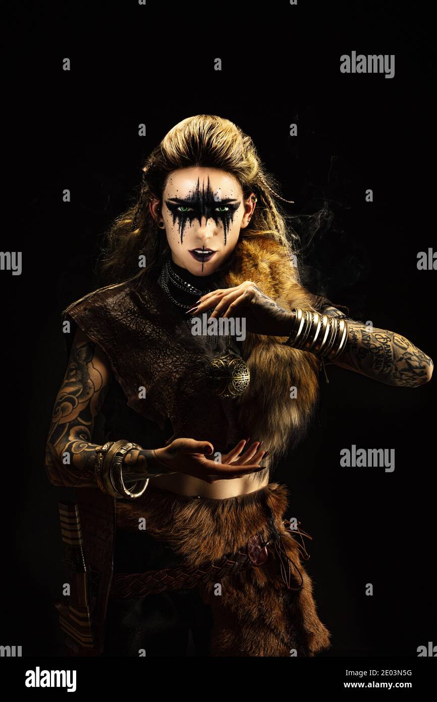 Portrait of a young viking shaman holding a ball of incense in his ...