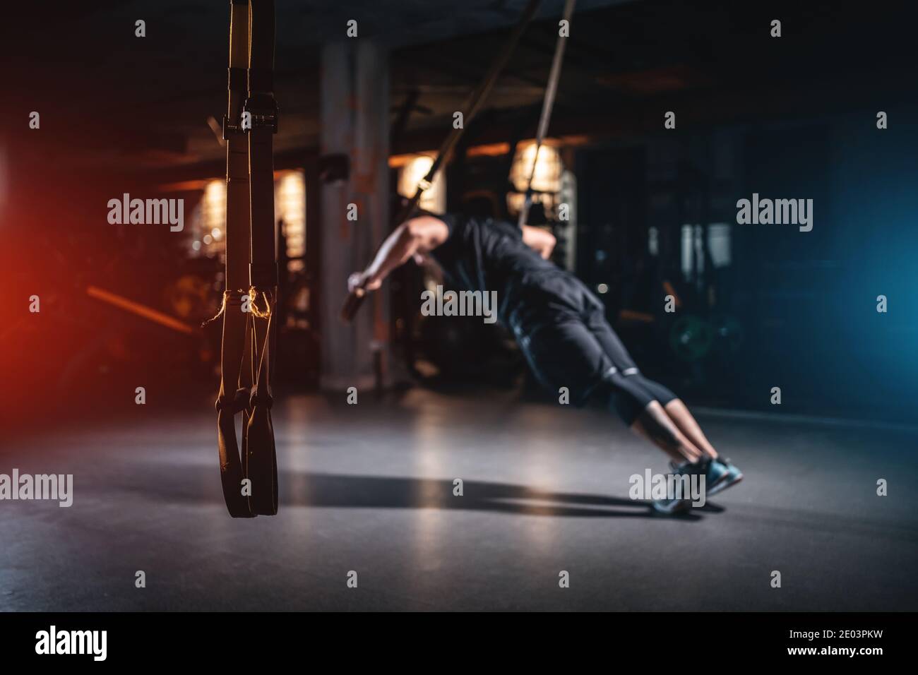young man has crossfit workout with trx in modern gym Stock Photo - Alamy
