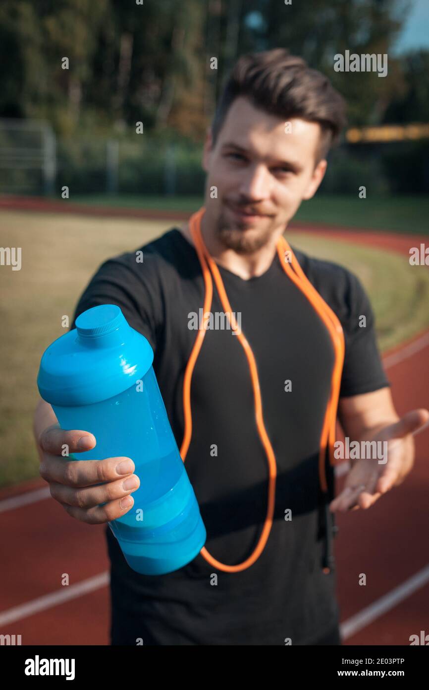 personal fitness trainer drink water or protein shake after workout