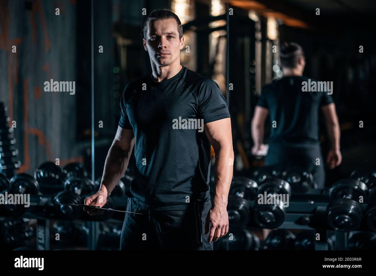 Handsome personal trainer stopwatch in hires stock photography and