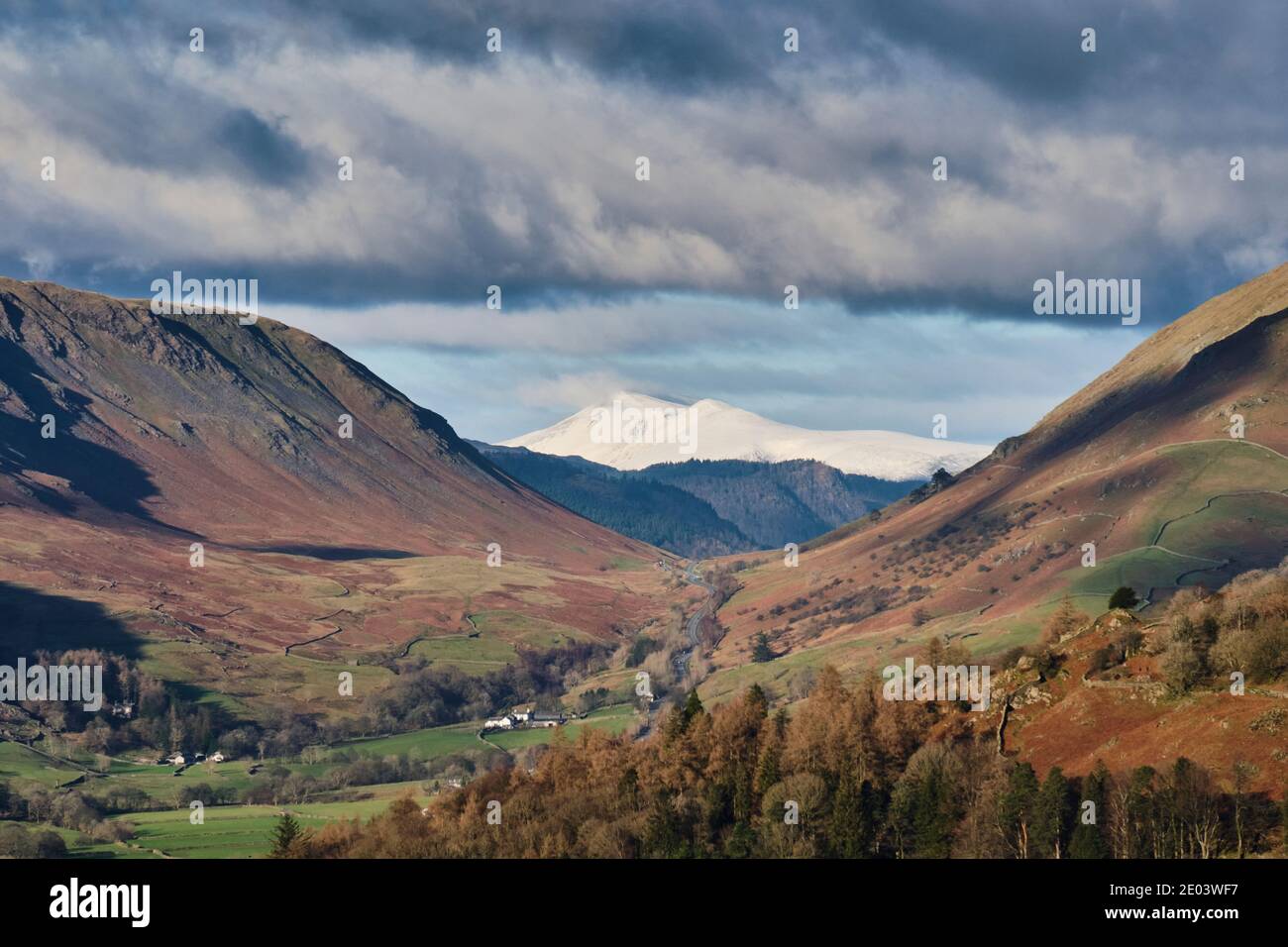 Snow-capped Skiddaw seen through Dunmail Raise from the summit of Loughrigg Fell, Grasmere, Lake District, Cumbria Stock Photo