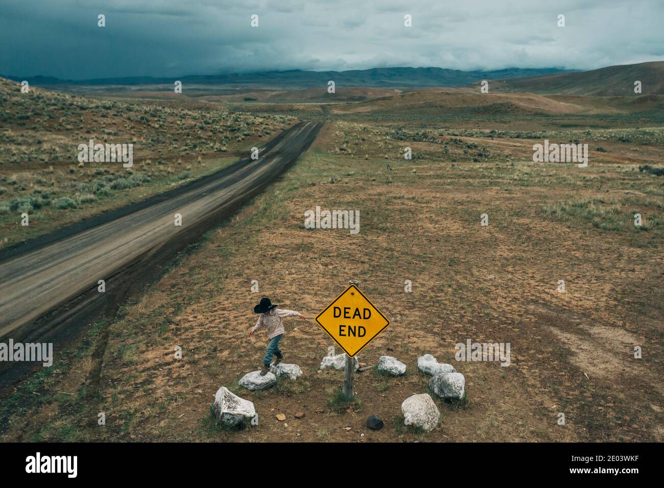 A Young Boy Jumps On Rocks Near A Dead End Road Near Owyhee Oregon Stock Photo Alamy