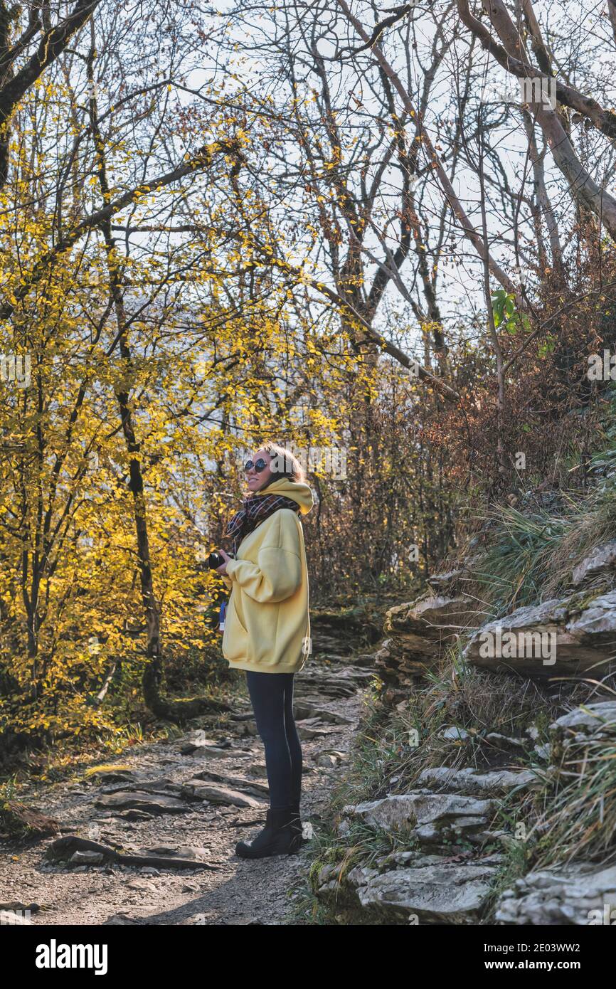 Woman walking in autumn park hi-res stock photography and images - Alamy