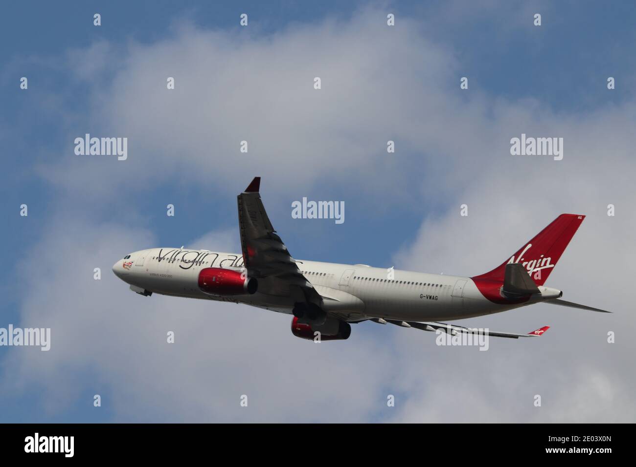A Virgin Atlantic A330 climbing out of Heathrow Airport Stock Photo