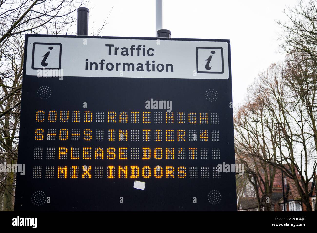 Electronic matrix sign with COVID 19 message in Southend on Sea, Essex, UK. COVID rate high, Tier 4, please don't mix indoors. Coronavirus warning Stock Photo