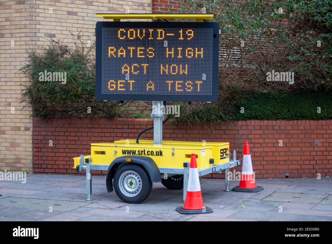 Electronic matrix sign with COVID 19 message in Southend on Sea, Essex, UK. Warning of high infection rates and advising to get a test. Act now Stock Photo