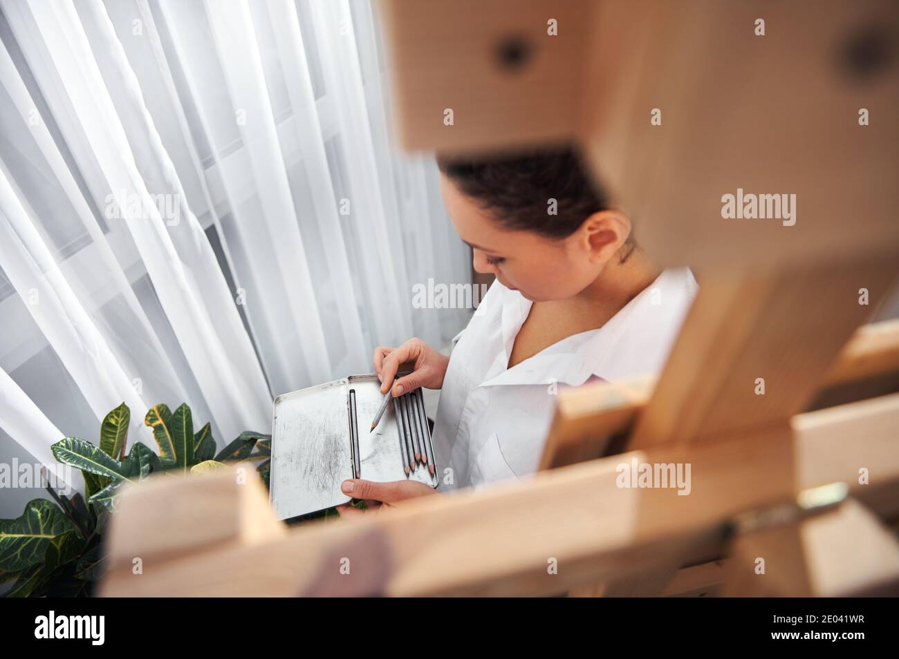 Holding colourful pencils hi-res stock photography and images - Alamy