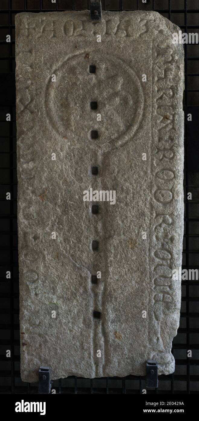 Gravestone of Maria Rodriguez. Inscription in Gothic script. Depiction of a Franciscan cord surrounding the head of a dog, 1417. From the Convent of Saint Francis, La Coruña, Galicia, Spain. Archaeological and History Museum of A Coruña (San Anton Castle). Galicia, Spain. Stock Photo