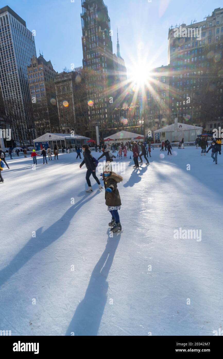 People enjoy Ice Skating at Bryant Park during the COVID-19 Pandemic. Stock Photo