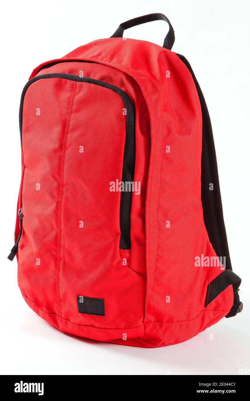 Red backpack with black details isolated on white background. For ...