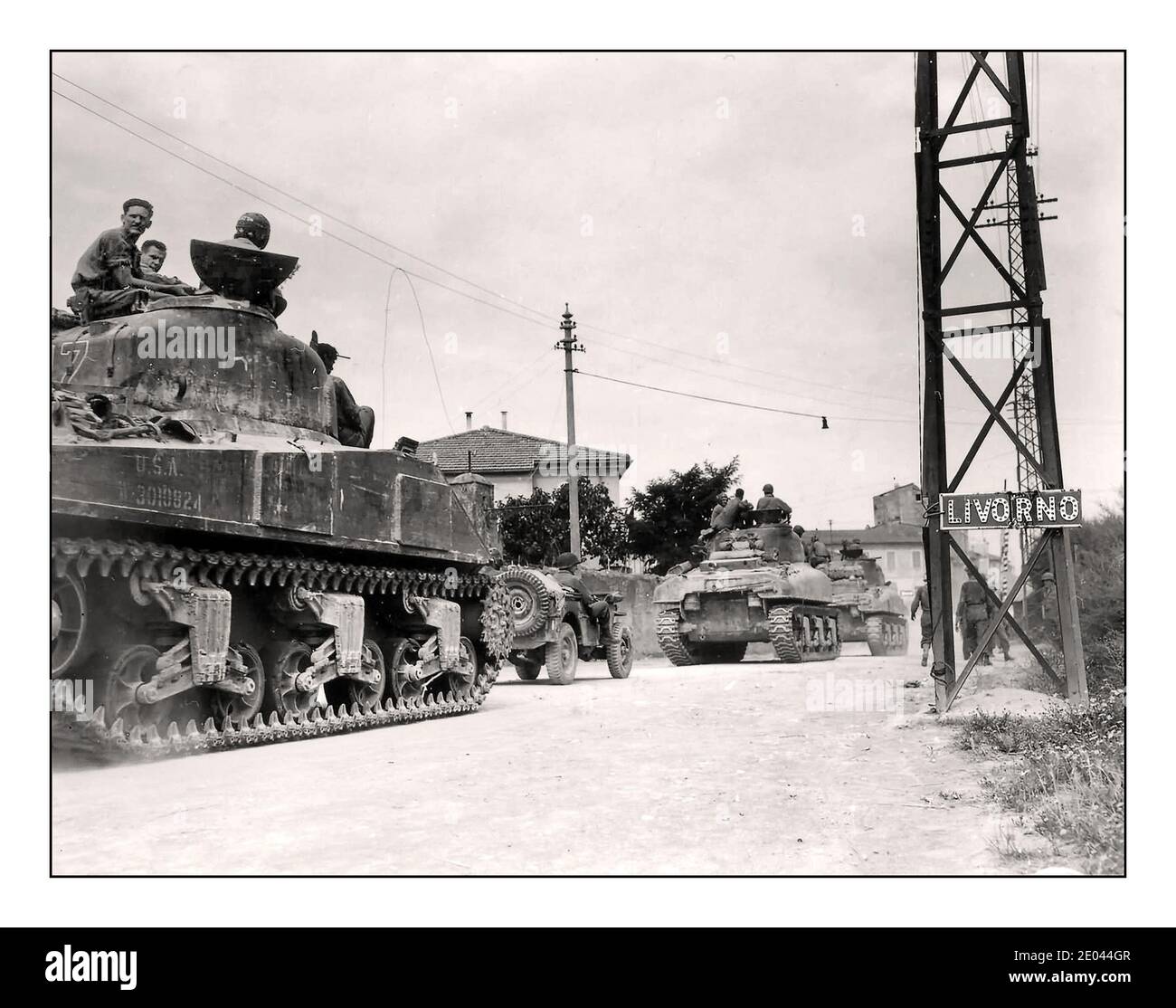 LIVORNO WW2 Anzio 34th Infantry Division. M4 Sherman tanks and Jeep entering Livorno Italy 1944 World War II Second World War  The Battle of Anzio was a battle of the Italian Campaign of World War II that took place from January 22, 1944 (beginning with the Allied amphibious landing known as Operation Shingle) to June 5, 1944 (ending with the capture of Rome). The operation was opposed unsuccessfully by German forces in the area of Anzio and Nettuno. Stock Photo