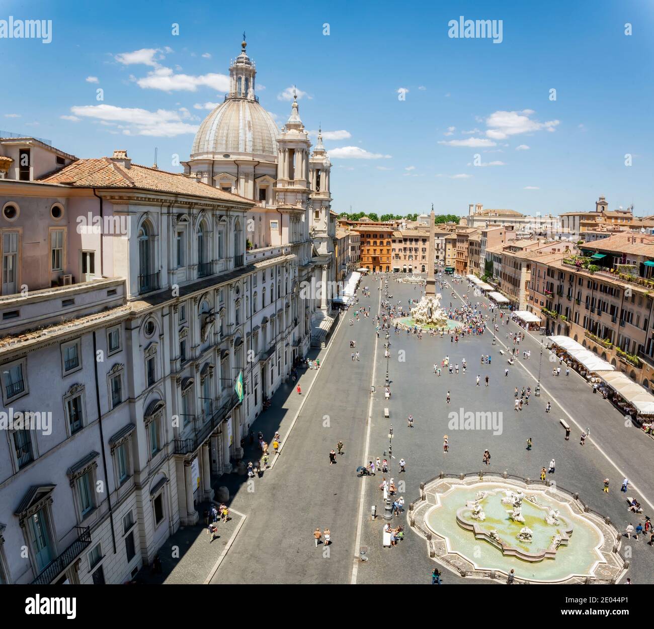 Top view of Piazza Navona in Rome with a crowd of unrecognizable tourists on a sunny day. Tourism and travel. Famous tourist destination. Baroque art Stock Photo