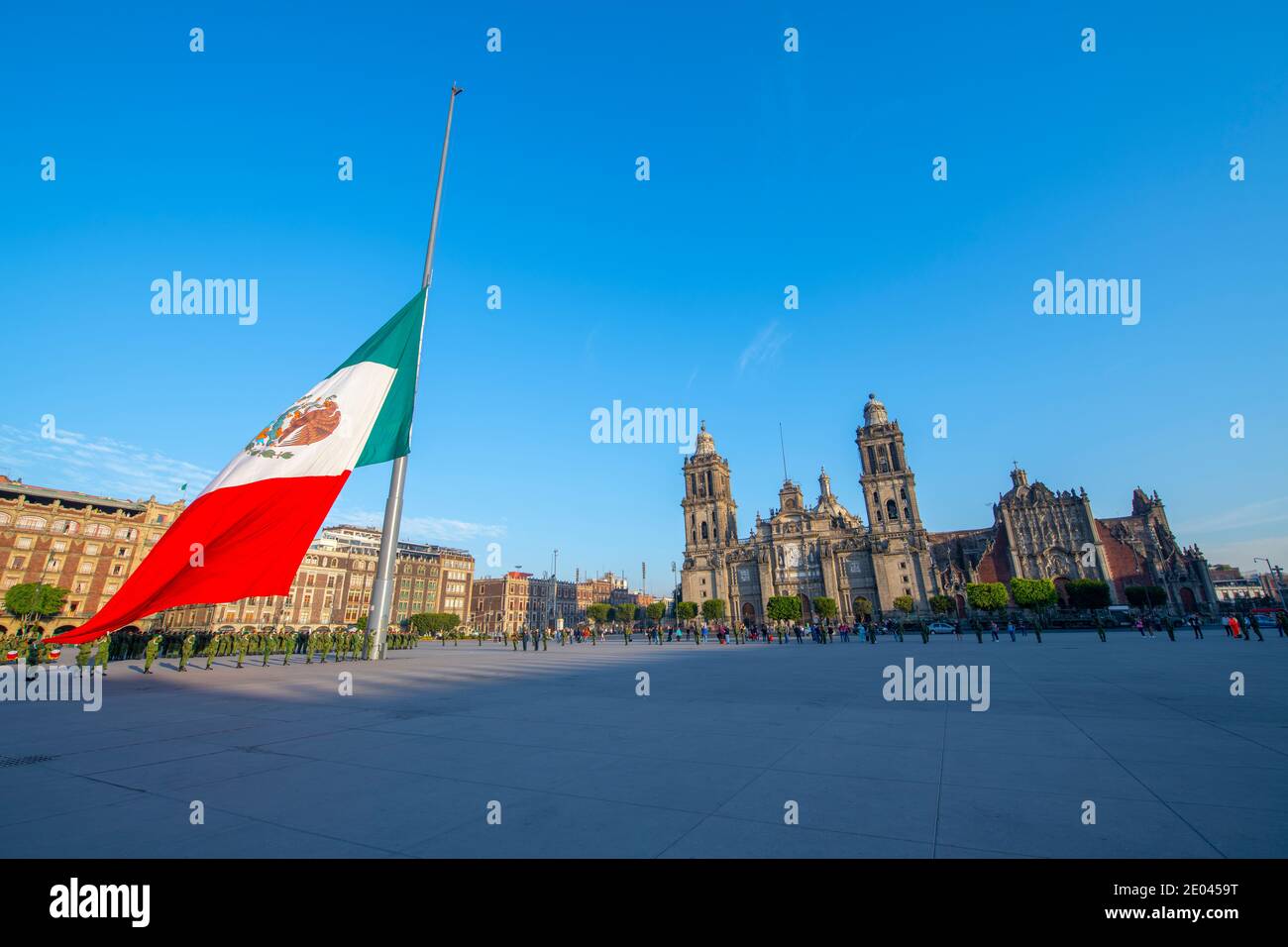 Raising Flag Guard of Honor stand on Zocalo in front of Metropolitan Cathedral at Historic center of Mexico City CDMX, Mexico. Stock Photo