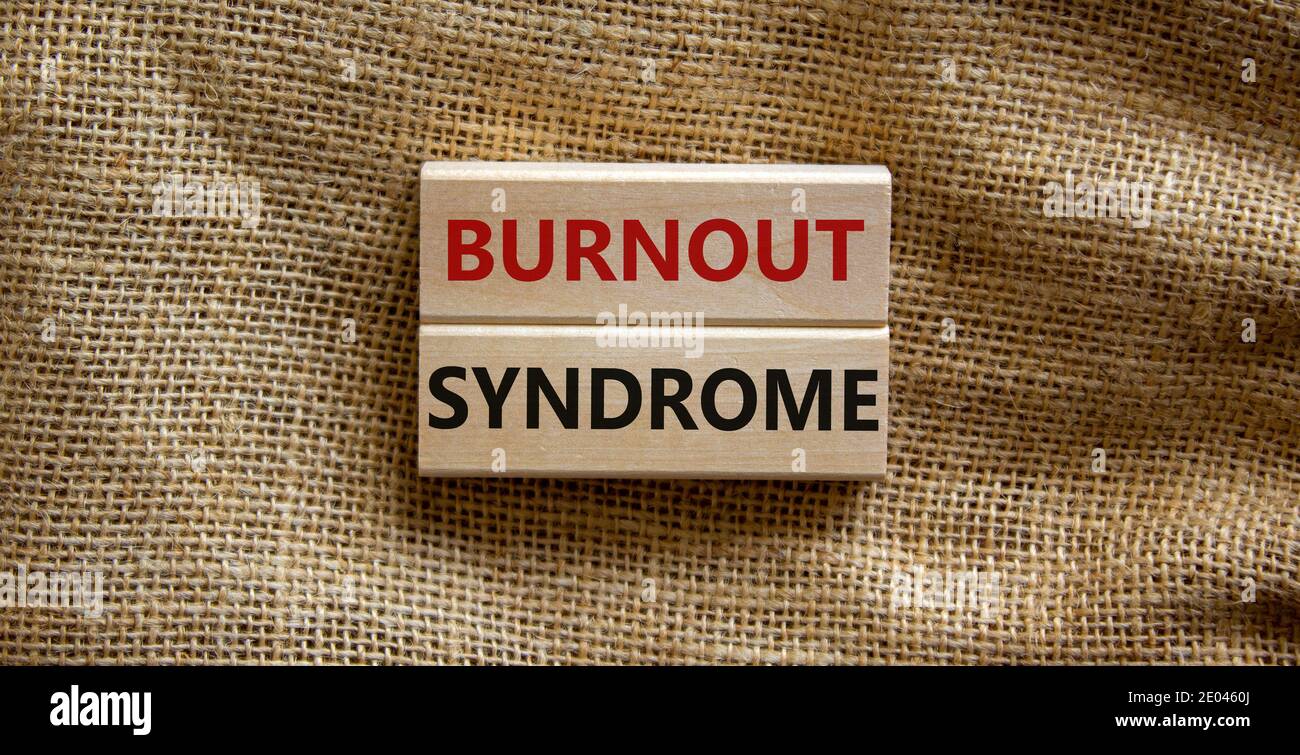 Burnout syndrome symbol. Wooden blocks form the words 'Burnout syndrome ...