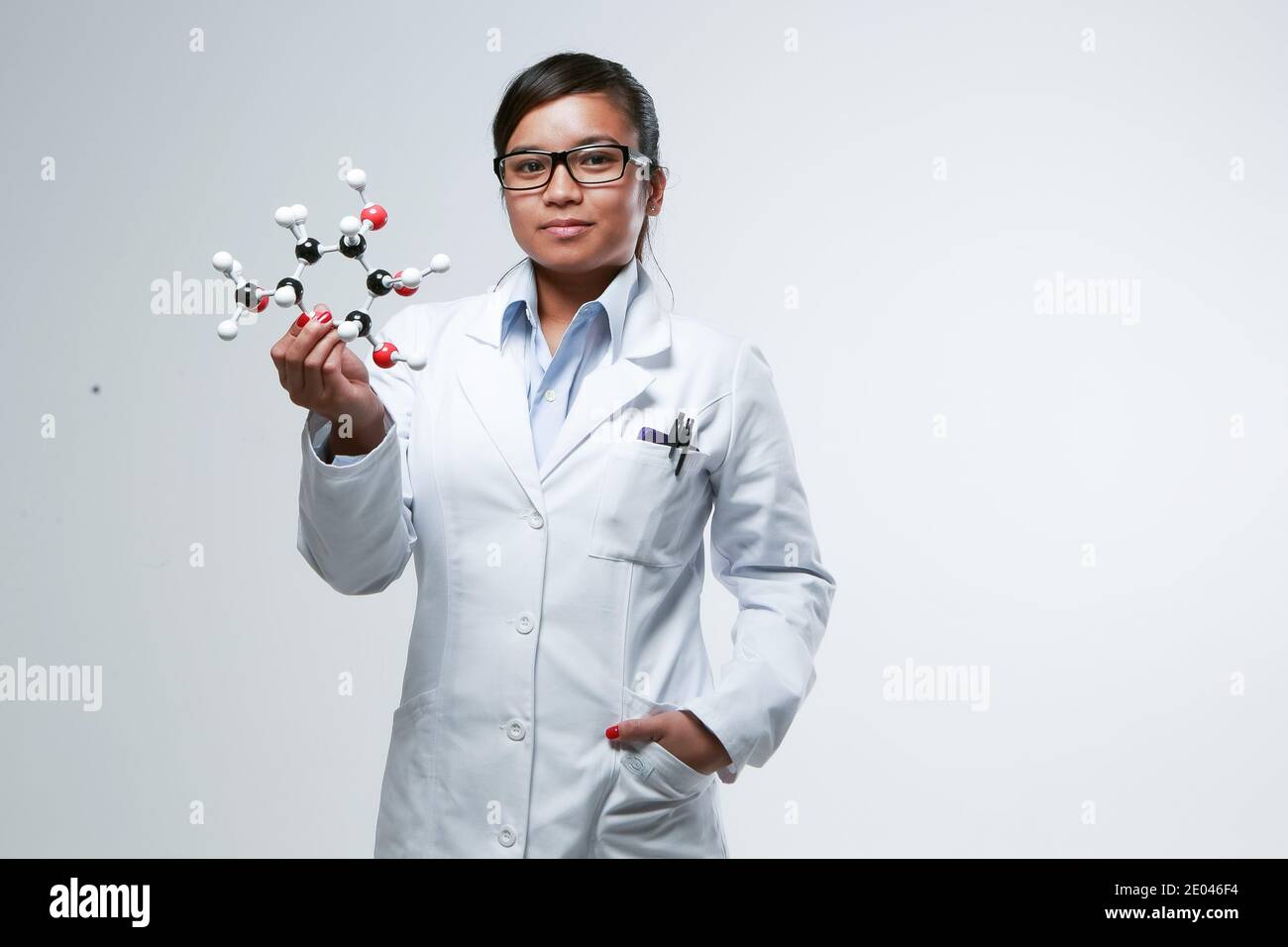 An asian female medicinal chemist holding a chemical matrix Stock Photo