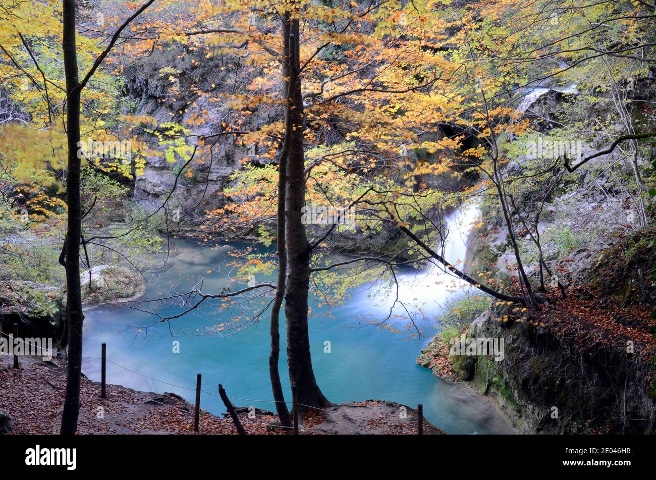 Autumnal image of a waterfall in the Urederra river, Navarra, Spain Stock Photo