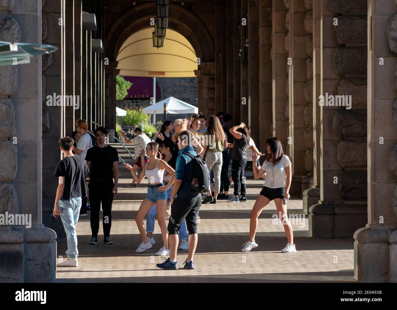 Group of teenagers and K-pop culture fans hanging out at the Largo as a popular spot for outdoor dancing in central Sofia Bulgaria EU Eastern Europe Stock Photo