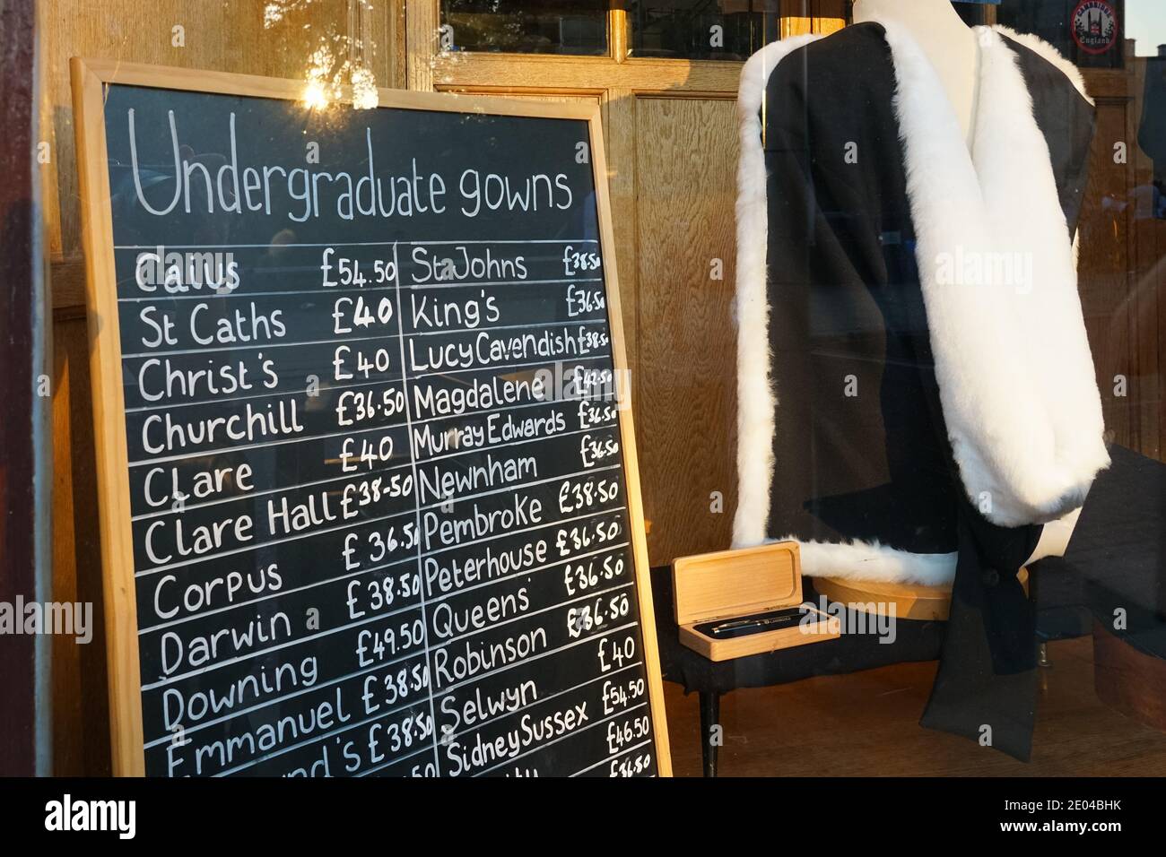 Prices of academic gowns at Ryder & Amies shop on King's Parade in Cambridge, Cambridgeshire England United Kingdom UK Stock Photo