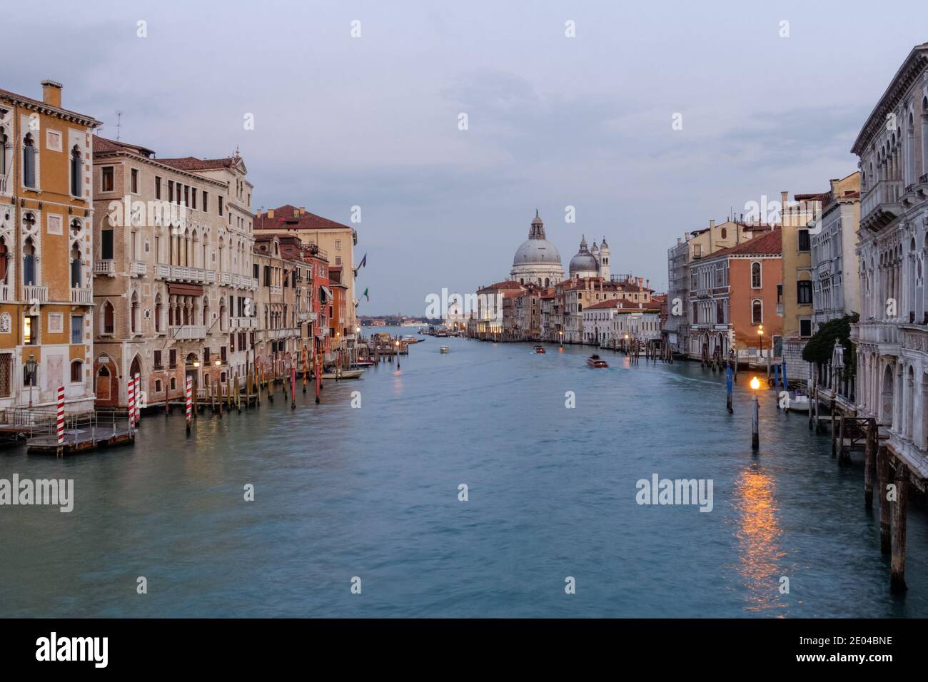 The Grand Canal at sunset with the Santa Maria della Salute basilica in ...