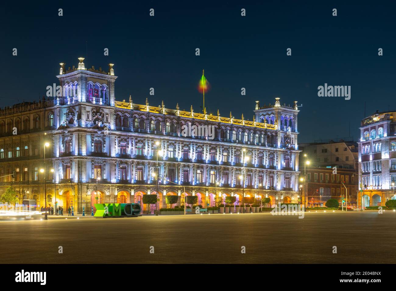 Federal District buildings at night on Zocalo Constitution Square, Mexico City CDMX, Mexico. Historic center of Mexico City is a World Heritage Site Stock Photo
