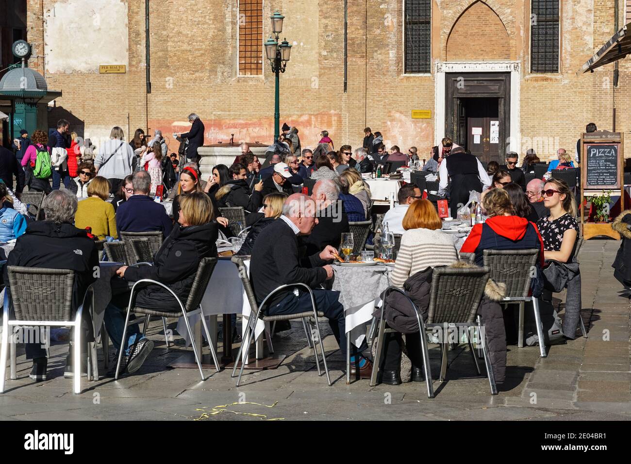 People sitting outside restaurant in the sestiere of Dorsoduro, Venice, Italy Stock Photo