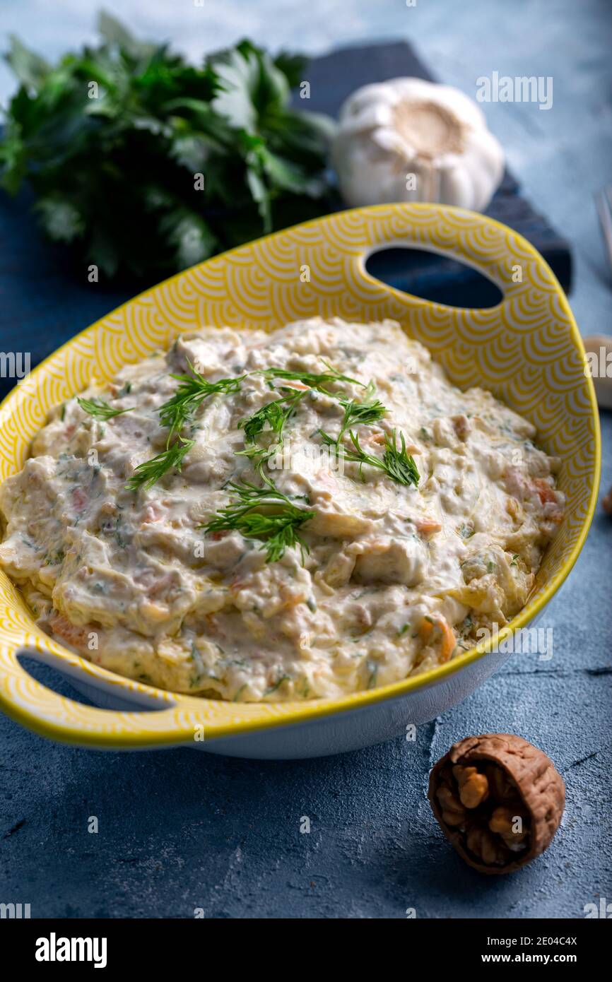Carrot and celery salad with yogurt and walnut Stock Photo Alamy