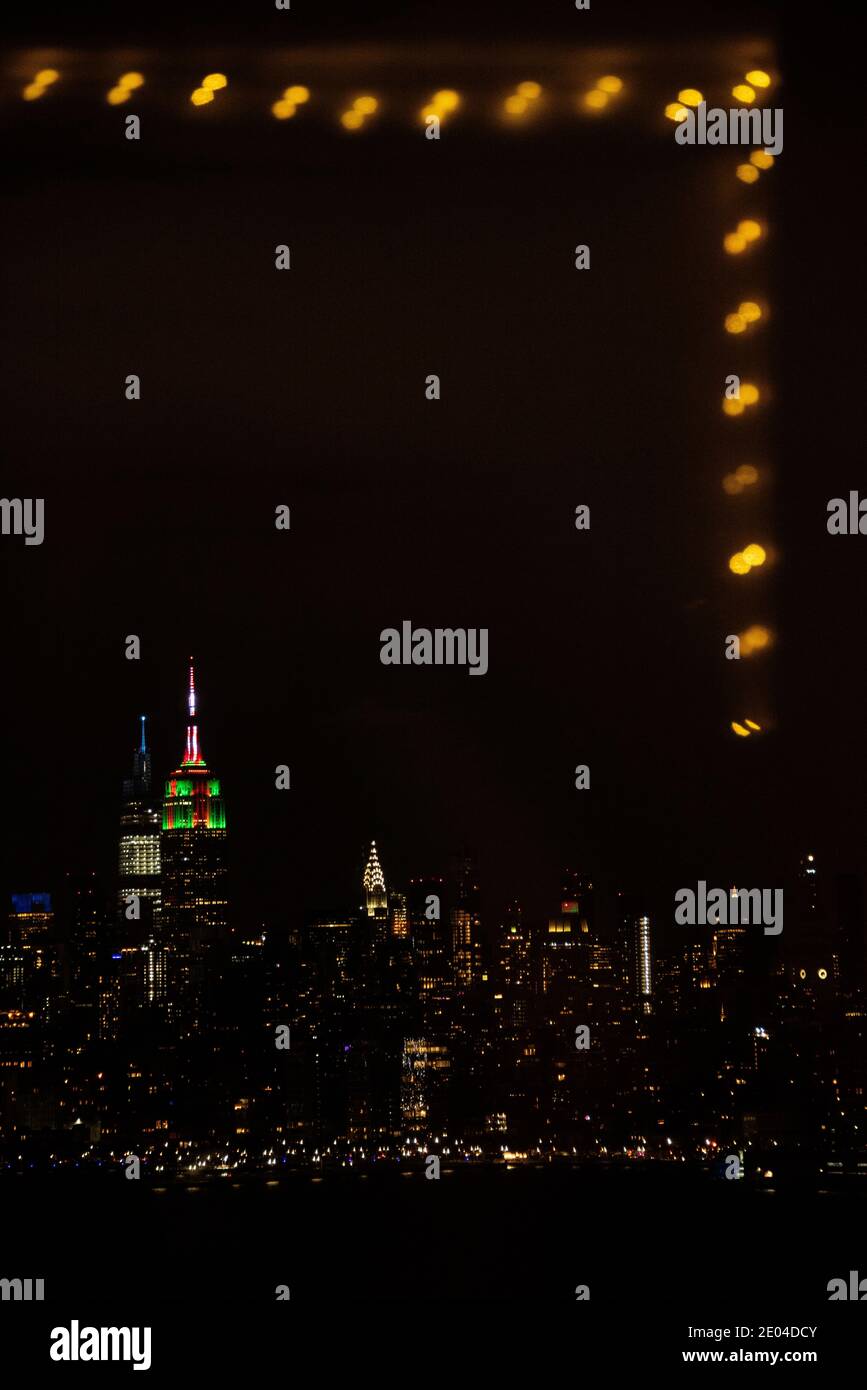 NYC at night during the holiday season framed by light reflections. Stock Photo