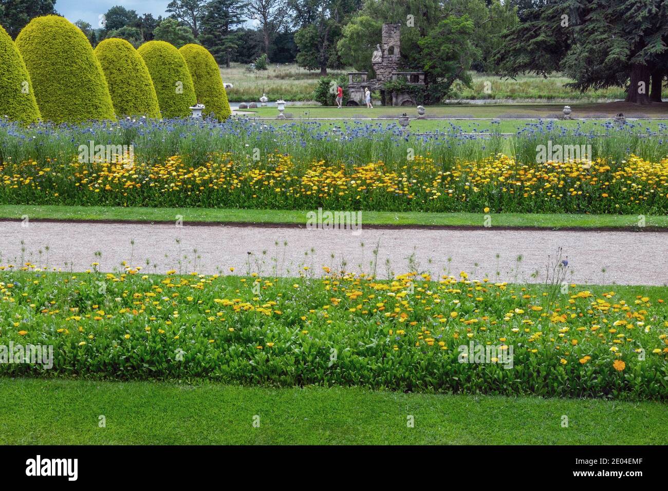 Flower beds and the Ruin, located in the grounds of the Shugborough Estate, near to Stafford, Staffordshire, England, UK Stock Photo