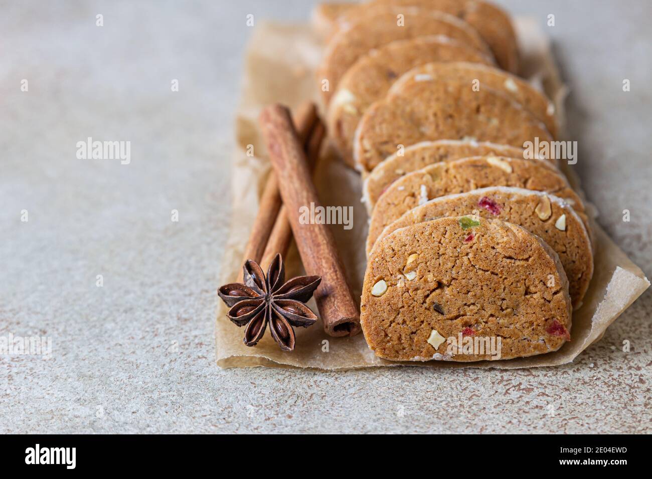Shortbread cookies with candied fruits on light concrete background. Tutti Frutti cookies. Selective focus. Stock Photo