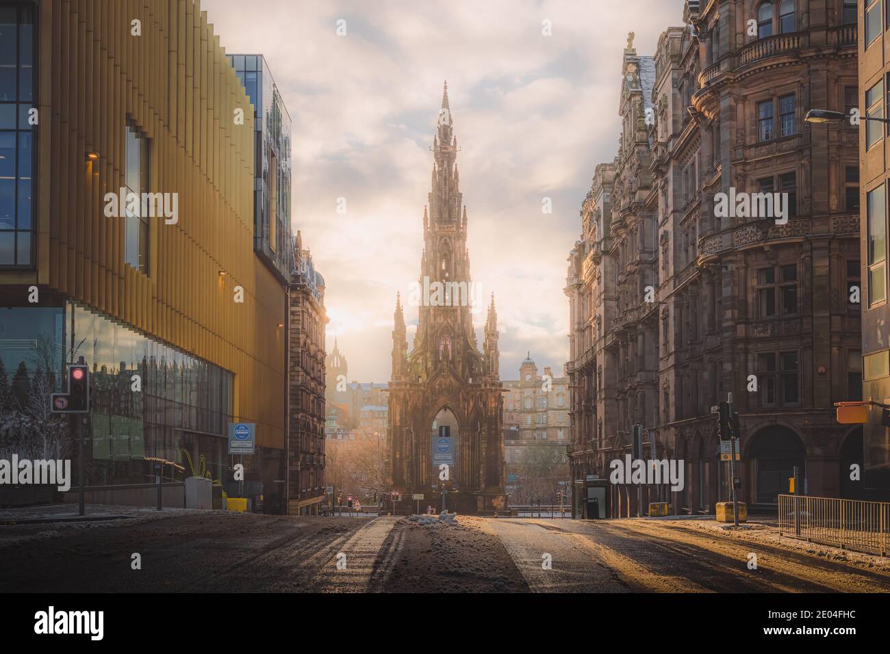 A view of the Sir Walter Scott Monument in Edinburgh on a winter's morning as golden light breaks through. Stock Photo