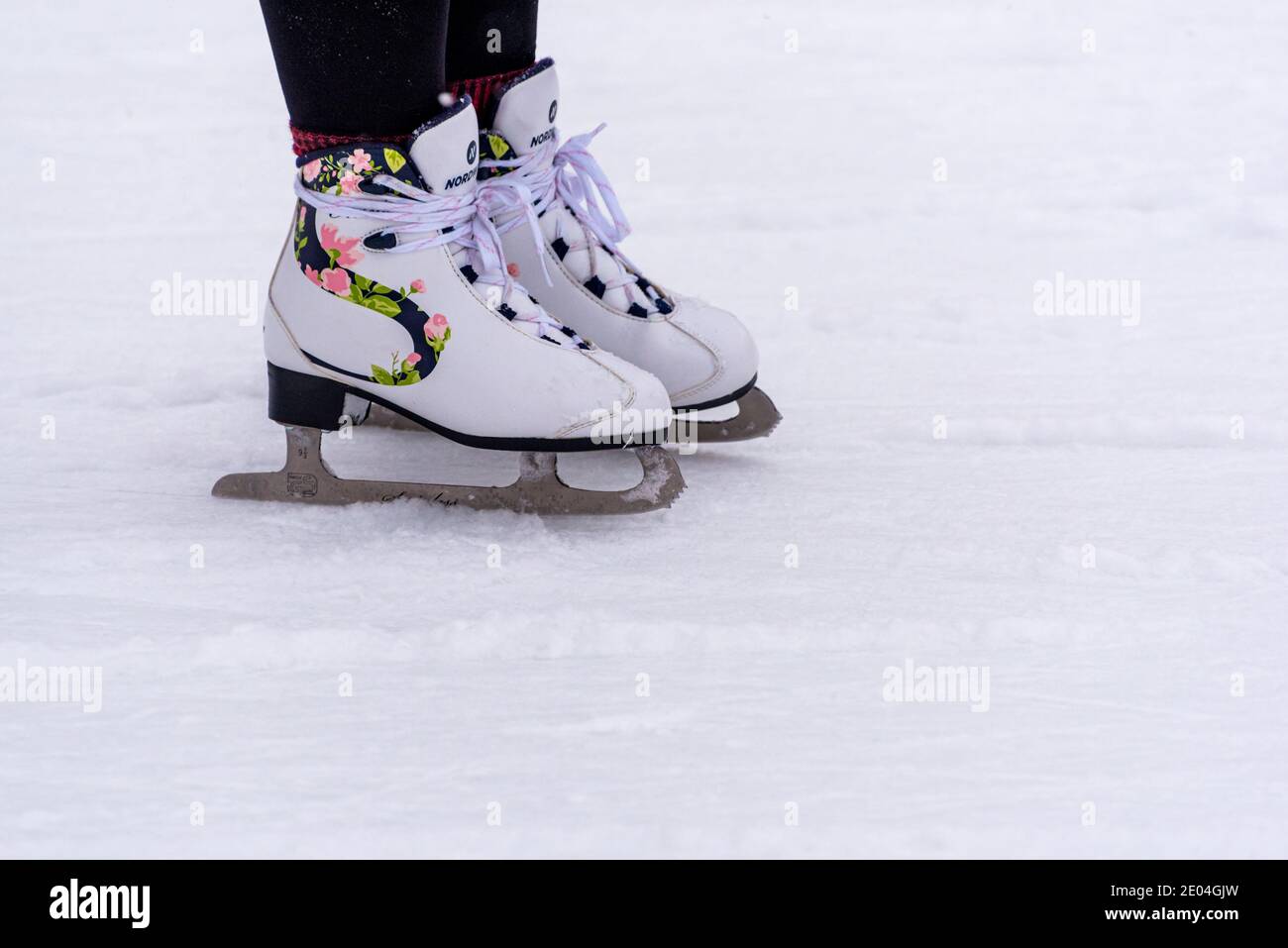 Saint Petersburg, Russia - December 26, 2020: women's ice skates Nordway on feet at ice rink. Stock Photo