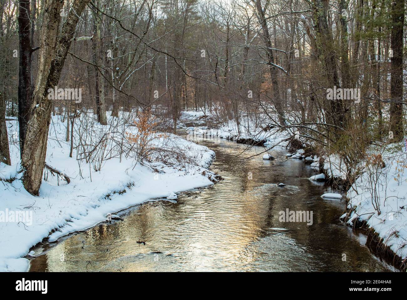 It's 10.6 miles long. Located in Southern New Hampshire, USA, it's a tributary of The Souhegan River and flows into the Merrimack River, and finally t Stock Photo