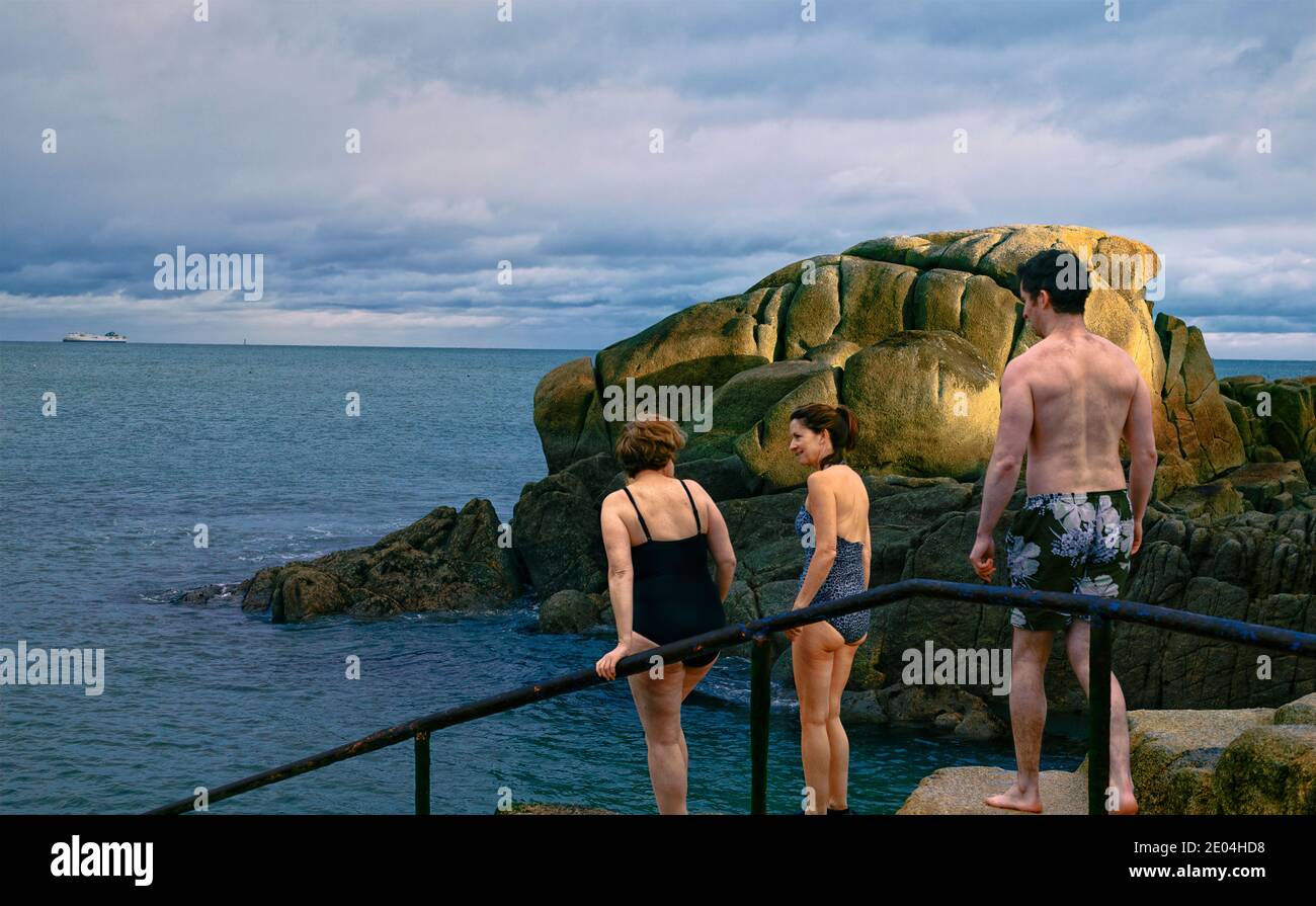 Winter Swimmers. Sandycove Forty Foot bathing area Dun Laoghaire near Dublin, Ireland, 27 December. Stock Photo