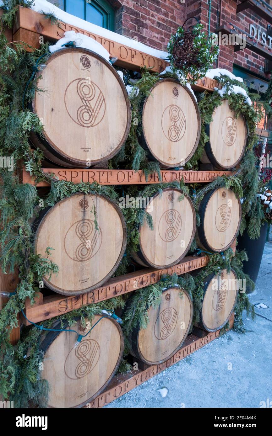 Old whiskey barrels stacked outdoors Stock Photo