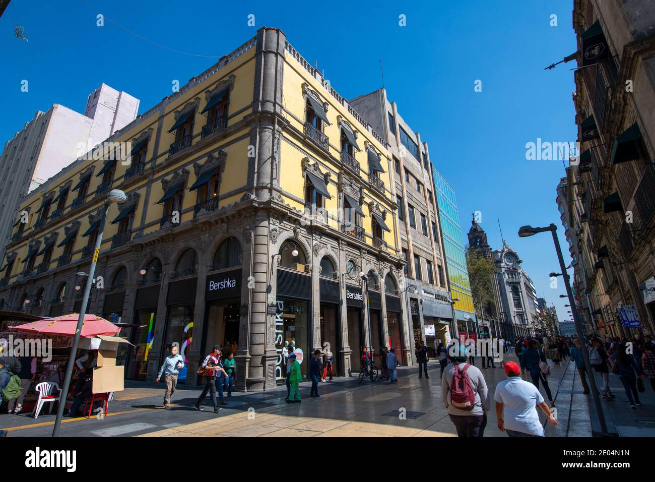 Historic buildings on Avenida Francisco Madero at Calle de Motolinia Street next to Zocalo Constitution Square, Mexico City CDMX, Mexico. Stock Photo