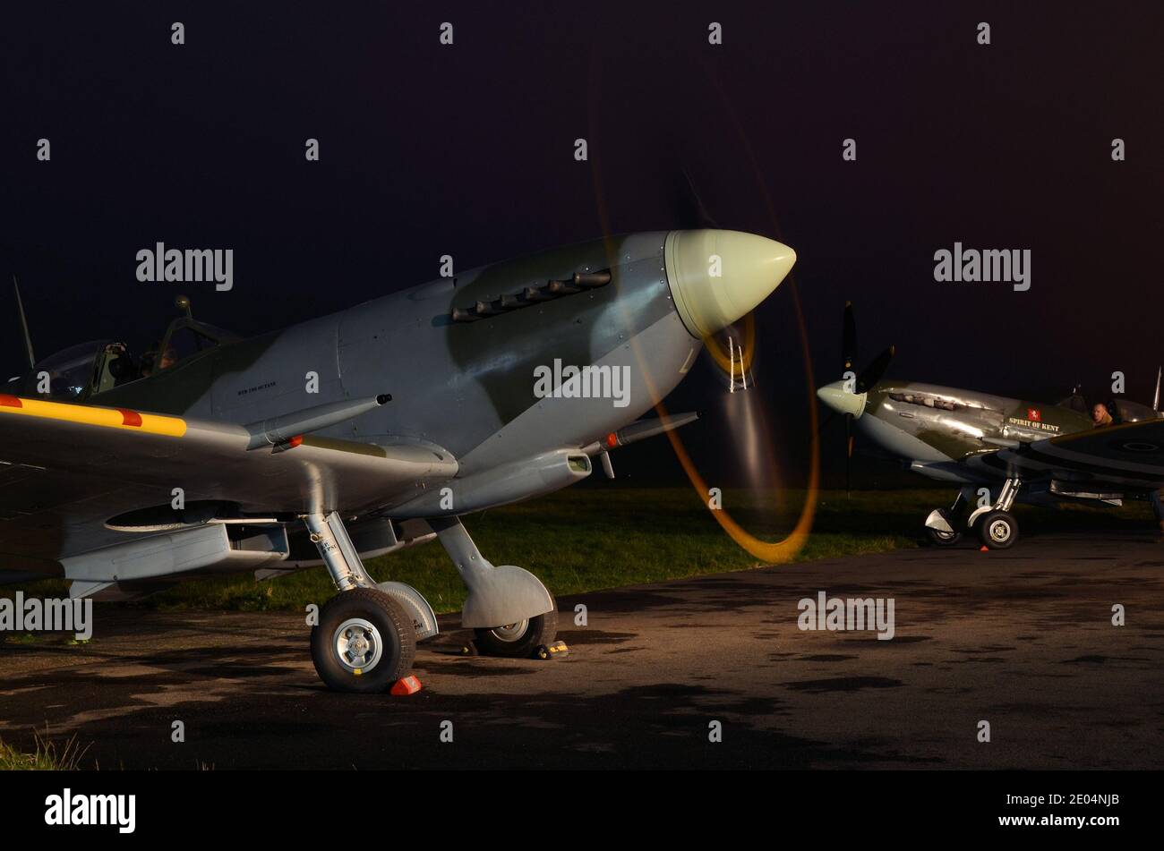 Biggin Hill Heritage Hangar Supermarine Spitfire at a night shoot at Biggin Hill Airport, Kent, UK. Spitfire IX planes MK912 and TA805 Stock Photo