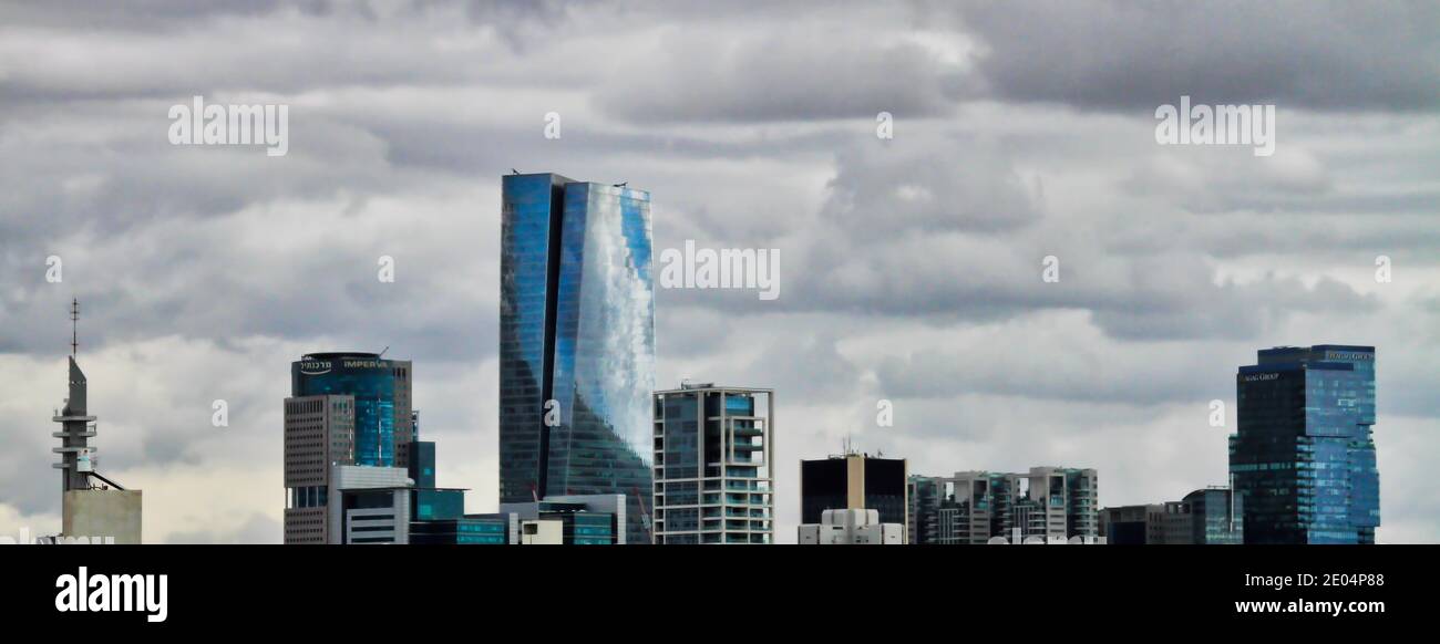 A partial panoramic view of the Tel Aviv business district skyline on a cloudy day. Stock Photo