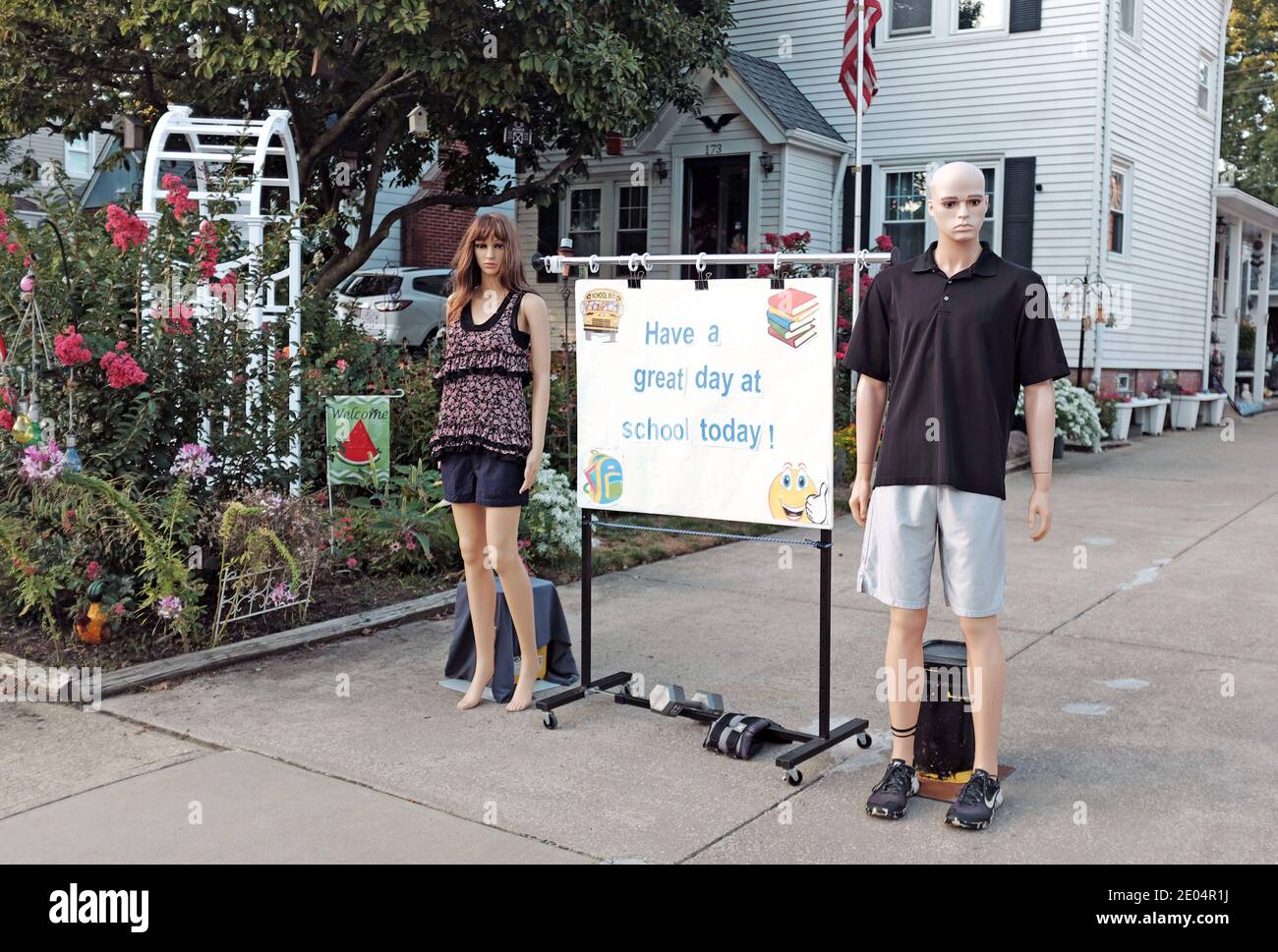 Kelly and Kevin, a mannequin couple in Ohio, wishes children a good first day at school from their driveway. Stock Photo