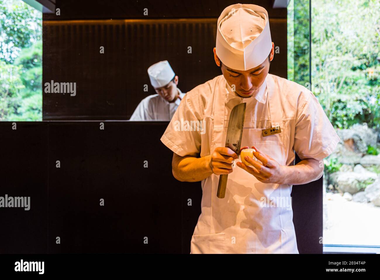 Chefs at Tokyo's Hotel Okura preparing lotus stems , Minato, Japan Stock Photo