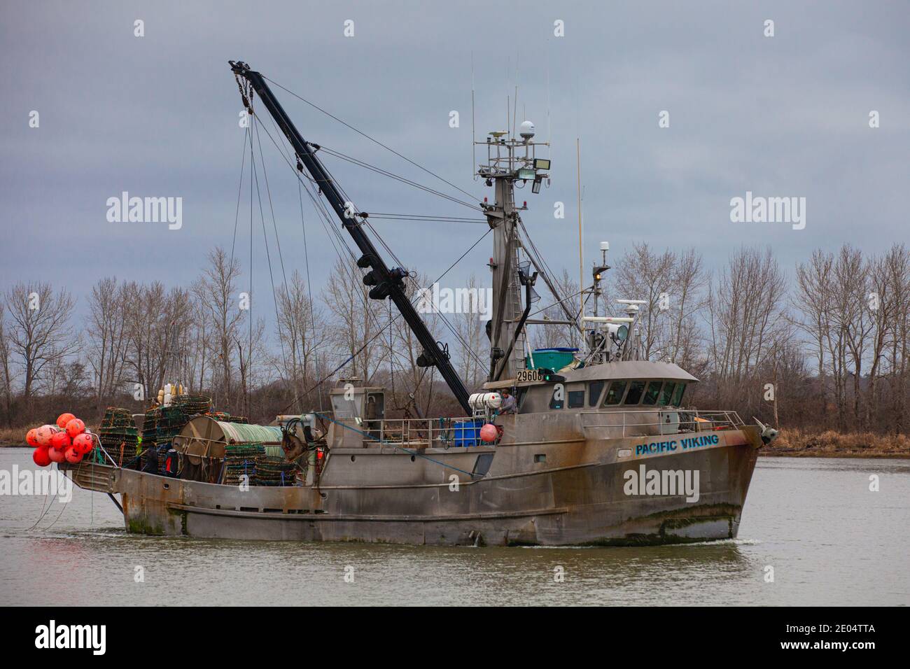 Commercial fishing vessel Pacific Viking heading out from Steveston Harbour to lay Crab Pots British Columbia Canada Stock Photo