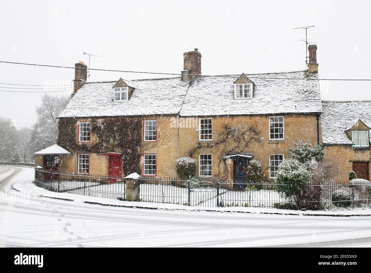 Cotswold stone cottages in the snow at christmas. Shipton Under