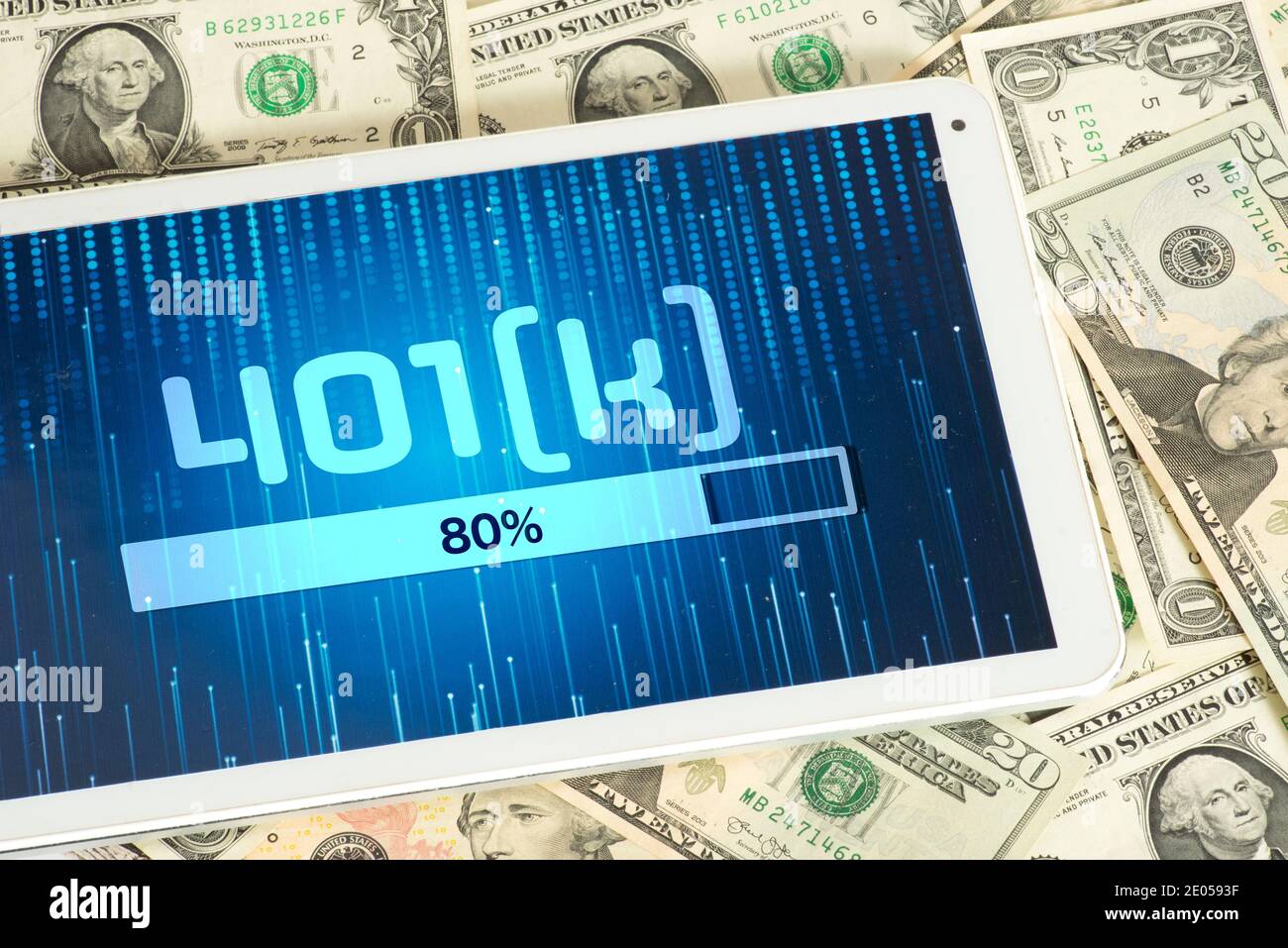 Dollar bills, tablet pc and 401k annuity plan Stock Photo