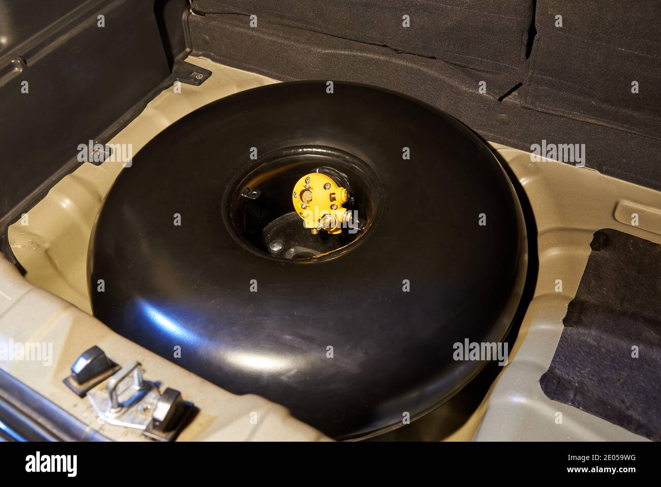 Gas bottle in the trunk of a car. Installation of gas equipment Stock