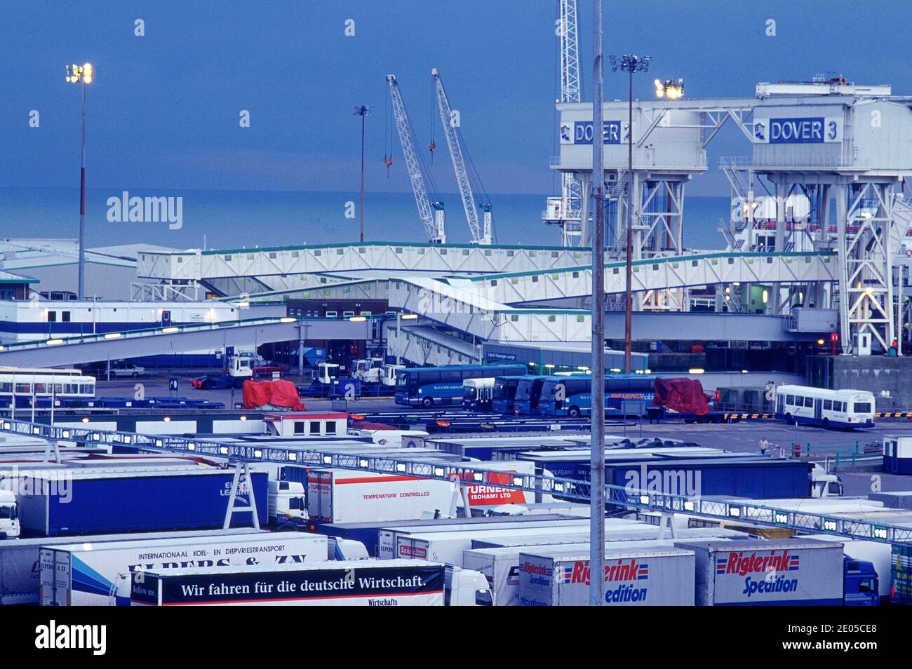 United Kingdom Dover Ferry Port Terminal with large ferry docked and trucks driving into it.English Channel . Stock Photo